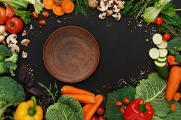 Frame of fresh vegetables on wooden background with copy space