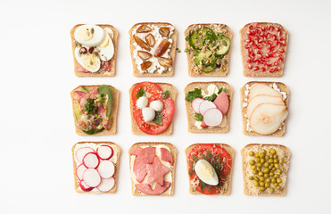 Assorted sandwiches on white background