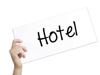 Hotel Sign on white paper. Man Hand Holding Paper with text. Isolated on white background