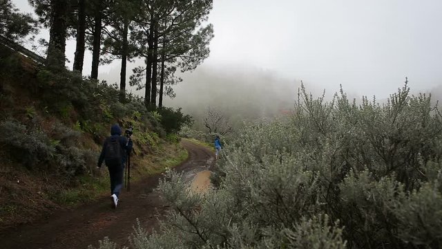 Tourists making photo of mountain landscape
