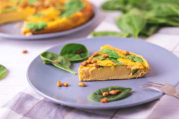 frittata with eggs, spinach, cheese and pine nuts