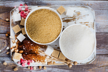 Fototapeta na wymiar Sugar variety on wooden table