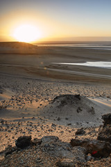 Sunrise in the Sahara by the Atlantic Ocean
