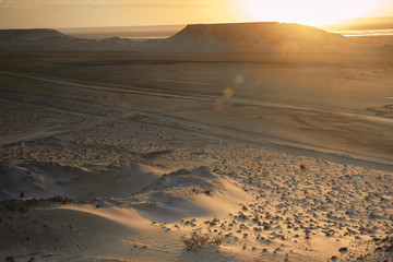 Fototapeta na wymiar Rising sun in the desert