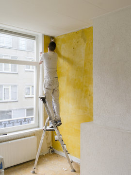 a plasterer working in a house