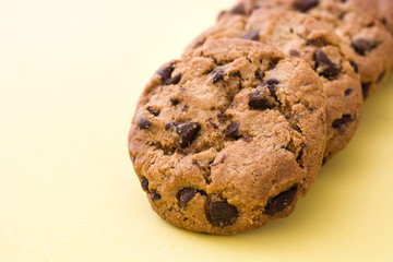 Chocolate chip cookies on yellow background
