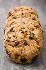 Chocolate chip cookies on wooden table background
