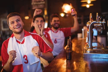 Foto op Plexiglas Group of male friends watching football match © WavebreakMediaMicro