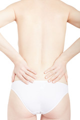 Young woman suffering from back pain isolated on white, clipping path