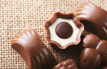 Horizontal close-up shot of chocolate candy placed on the canvas.