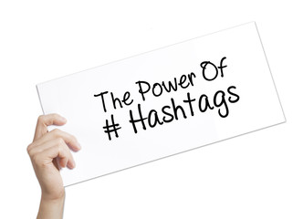 The Power of Hashtags Sign on white paper. Man Hand Holding Paper with text. Isolated on white background