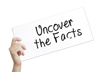 Uncover the Facts Sign on white paper. Man Hand Holding Paper with text. Isolated on white background