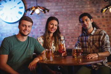 Portrait of young friends having cocktail drink