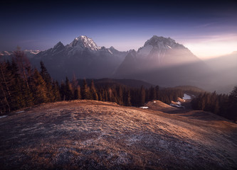 Mountain panorama in the bavarian alps at sunset with the peaks Watzmann and Hochkalter near...
