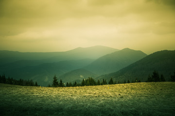 Naklejka premium A beautiful hillside scenery of Tatra mountains. Warm summer haze, colorful contrast look.