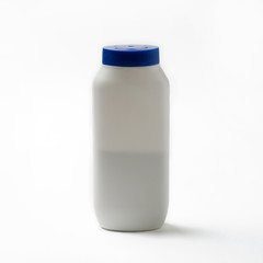 Body powder bottle on white background.