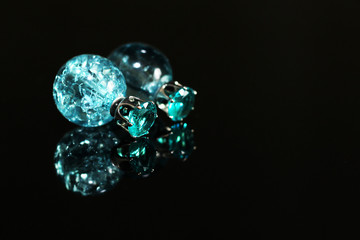 Beautiful earrings on a black background
