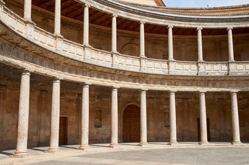 Palace Carlos V, interior circular patio. Rows of columns. Alhambra, Granada, Spain.