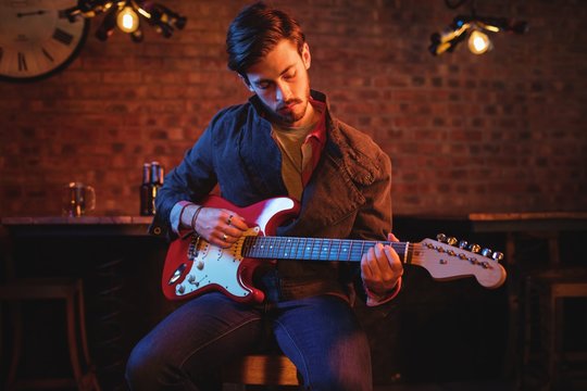 Young man playing guitar 