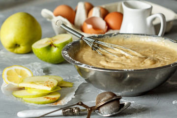 Ingredients for pastry dough pie: dough, eggs, kefir (milk), apples, powdered sugar.