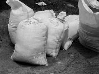 BLACK AND WHITE PHOTO OF SANDBAG OR SACK MADE OF HESSIAN (BURLAP) OR POLYPROPYLENE