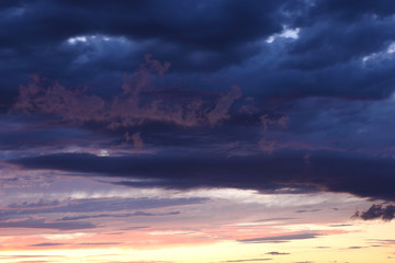 Sunset with dark clouds before storm