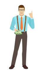 Businessman with cash money pointing up