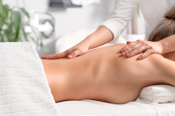 Obraz na płótnie Canvas Woman having massage of body in the spa salon.