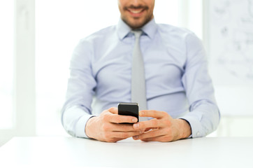 close up of businessman with smartphone