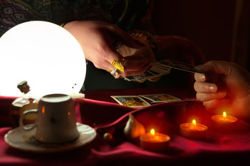 Fototapeta na wymiar Woman fortune teller receive money from another woman