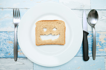 Smiled bread toast on a plate