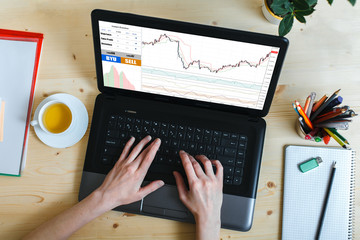 Businessman Working Plan On A Wooden Table. Working Home Concept