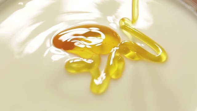 Pouring honey in the yogurt slow motion