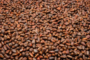 Pine nuts in the form of a background.