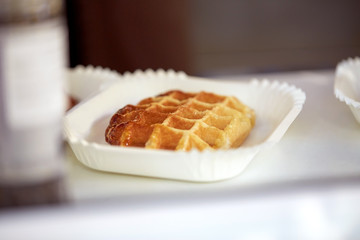 close up of waffle on paper plate