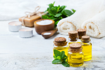 Organic essential oil with green mint leaves, spa concept