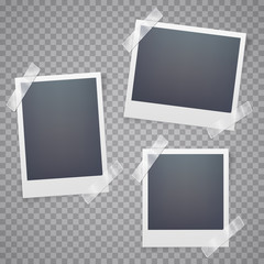 Collection of blank photo frames with adhesive tape.