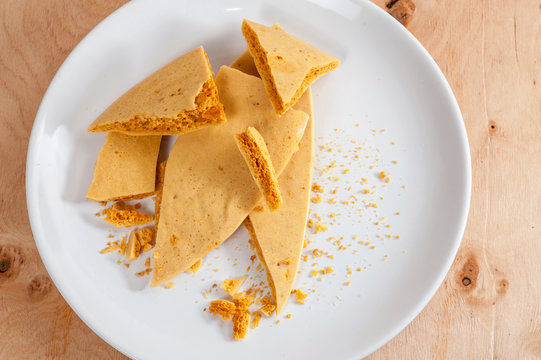 Caramel honeycomb on a white plate 04