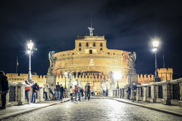 Fototapeta na wymiar ITALY - ROME - APRIL 26 2017- A couple is taking a selfie in front of Castel Sant'Angelo. Rome, April 26 Castel Sant'Angelo (AD 135), is a museum and art gallery in the heart of Rome.