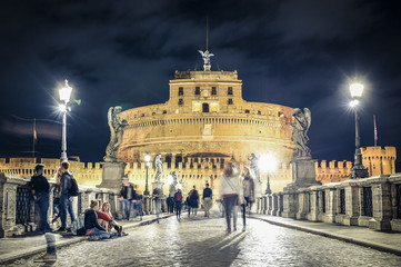 Obraz na płótnie Canvas ITALY - ROME - APRIL 26 2017- Girls are sitting on the ground talking each other. Rome April 26 Castel Sant'Angelo is a museum and art gallery in the heart of Rome.