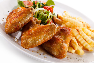 Fried chicken wings with french fries