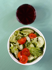 Sherry juice and salad from tomatoes, cucumbers and herbs.