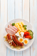 Breakfast with eggs and sausages