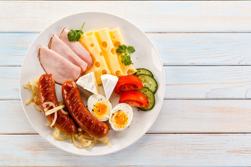 Breakfast with eggs and sausages