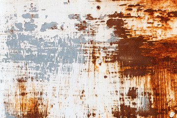 A background of peeling paint and rusty old metal