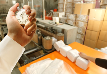Process of paper products manufacturing and stopwatch in hand
