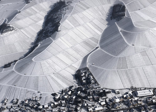 Aerial view of town by snow covered agricultural fields, Hohenheim, Stuttgart, Baden-Wuerttemberg