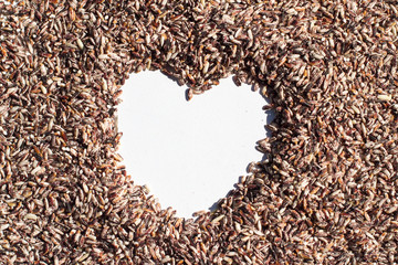 Whole grain rice in Heart Shape space Background