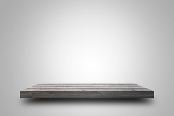 Empty wooden shelf on white background. For display or montage your products with focus wooden shelf top in the foreground