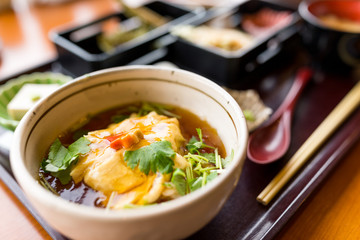 Japanese tofu soup bowl in restaurant